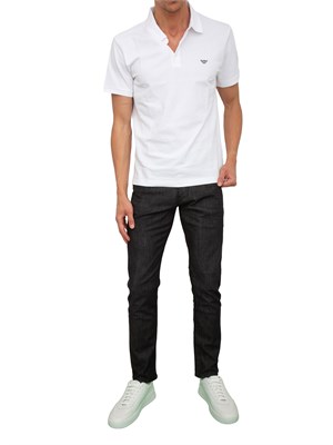 Jeans uomo slim fit Emporio Armani in denim nero effetto used in UOMO