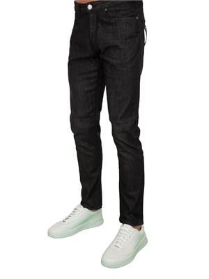 Jeans uomo slim fit Emporio Armani in denim nero effetto used in UOMO
