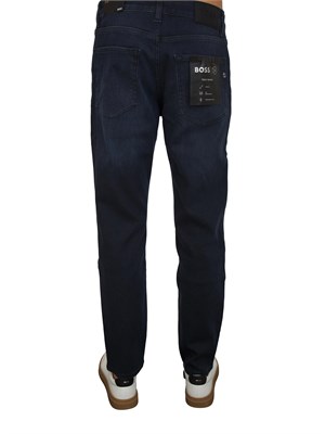 Jeans Boss uomo in pregiato denim blu effetto used in UOMO