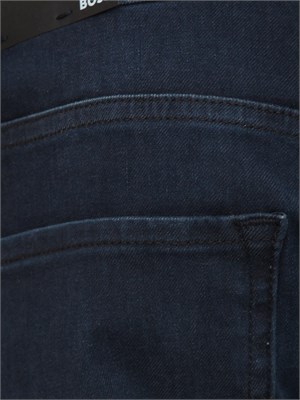 Jeans Boss uomo in pregiato denim blu effetto used in UOMO